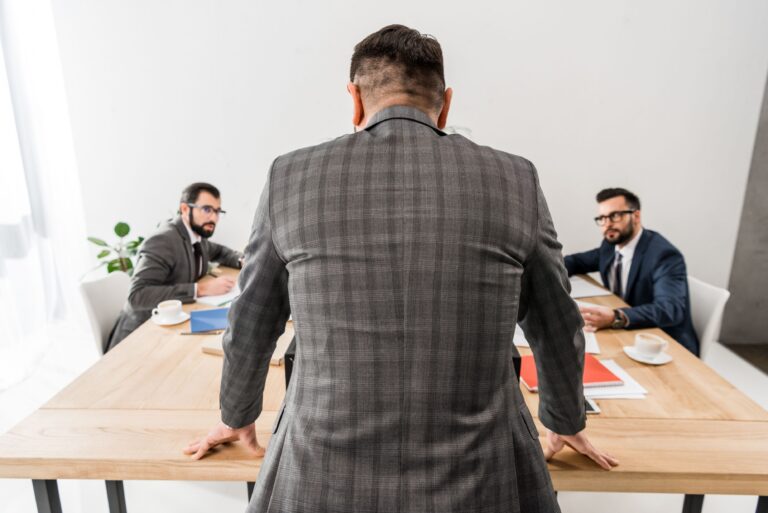 Lawyer deposing a witness in a conference room