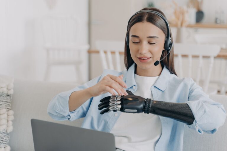 woman with a prosthetic arm in workplace - disability discrimination