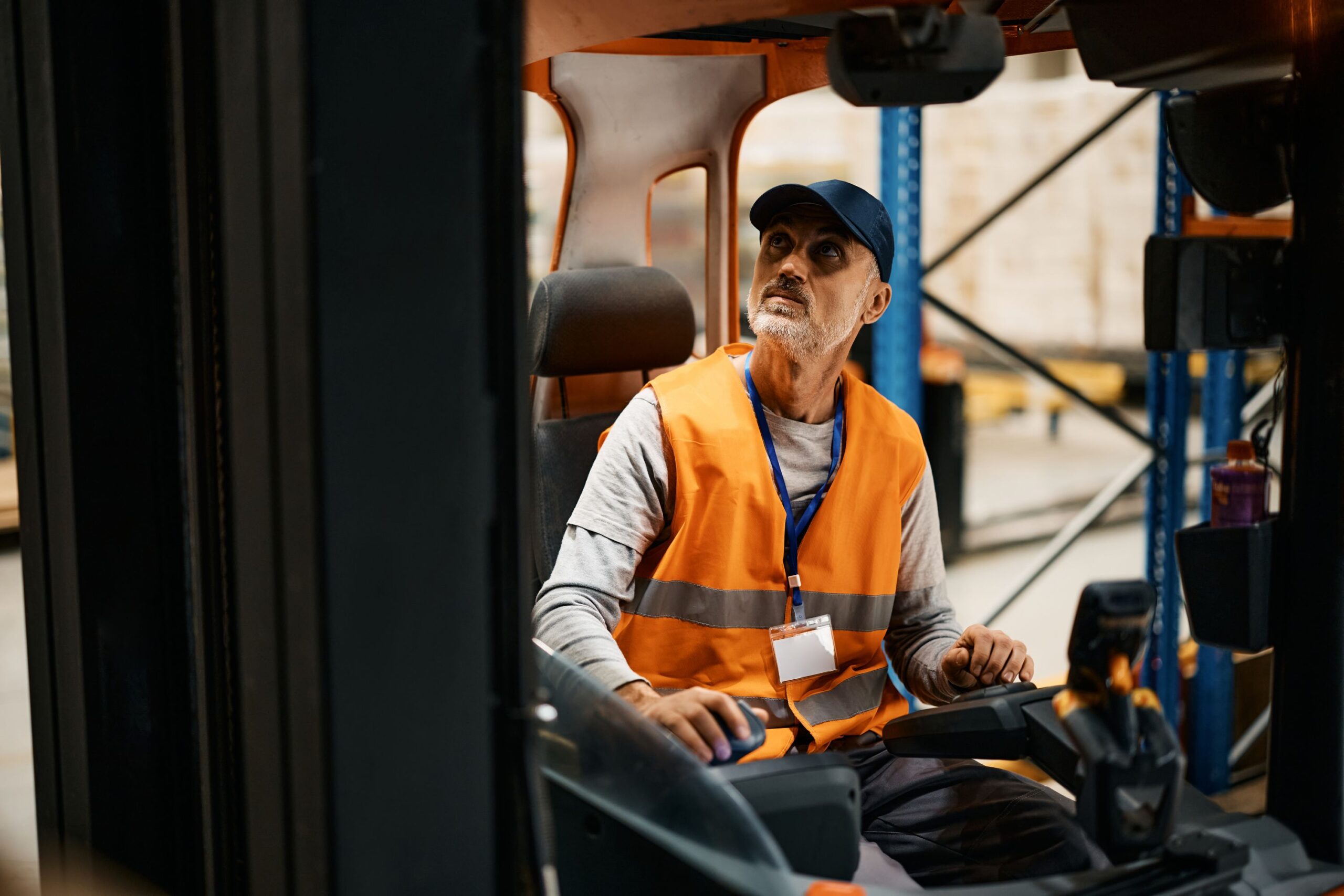 mature-warehouse-worker-moving-pallets-with-forkli-2022-11-29-22-44-33-utc worker at factory experiencing harassment
